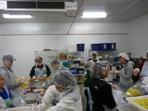 TA packing wax beans at OFB West. Photo by Scott Grossaint.